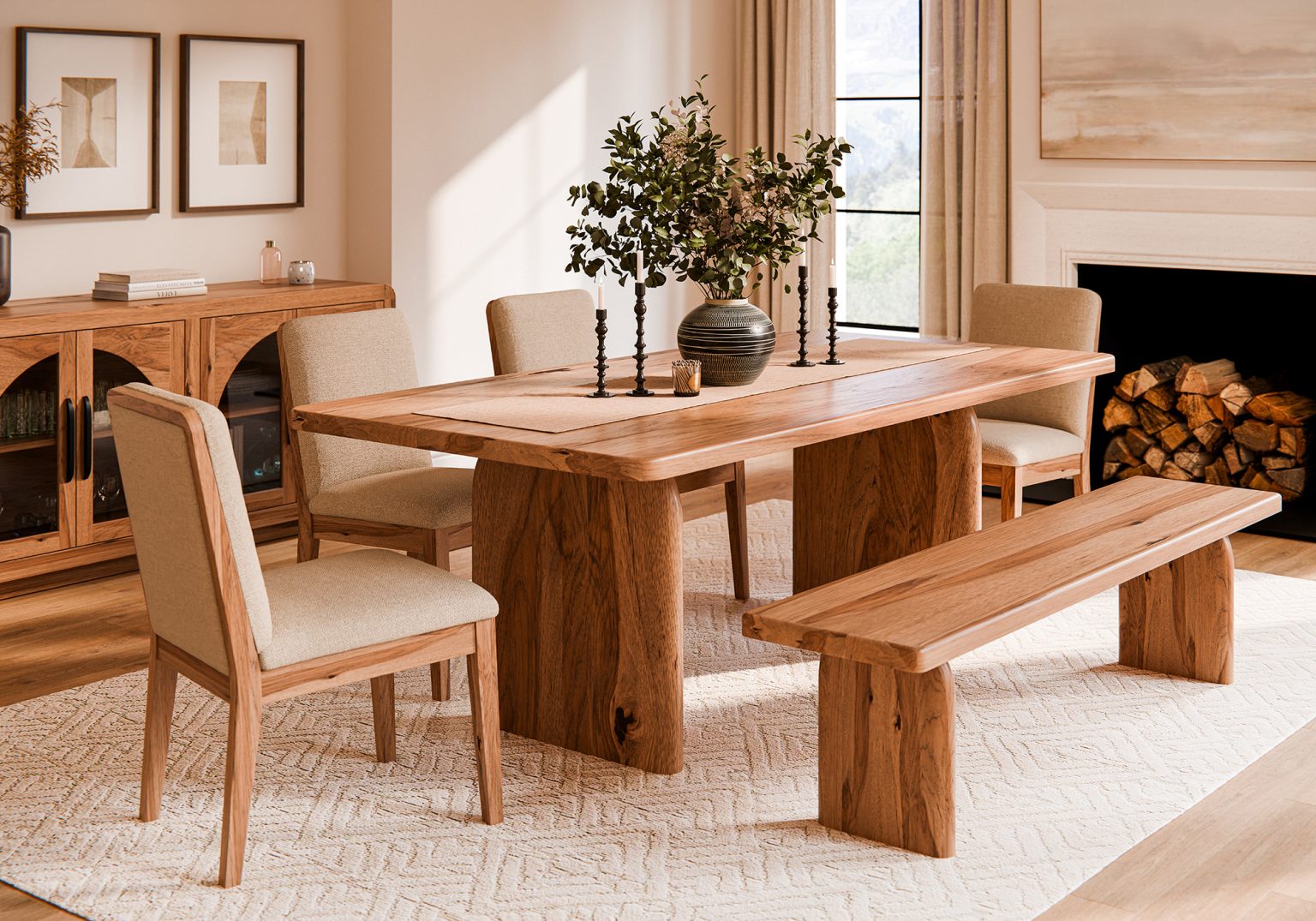 A heavy plank-top hickory dining table with a matching bench in a bright white room