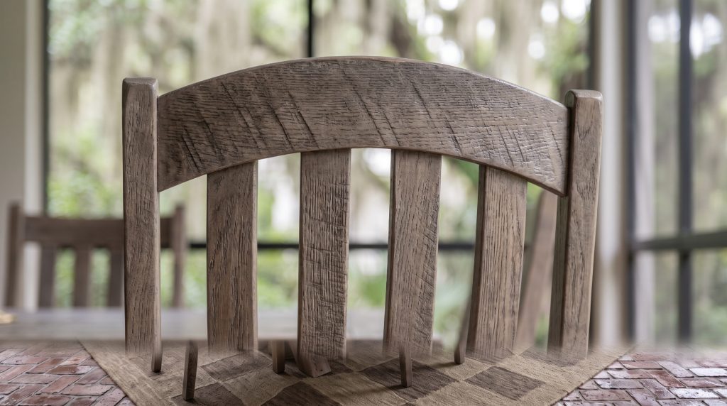 Four curved slats: The tall slats meeting the arched crest rail.