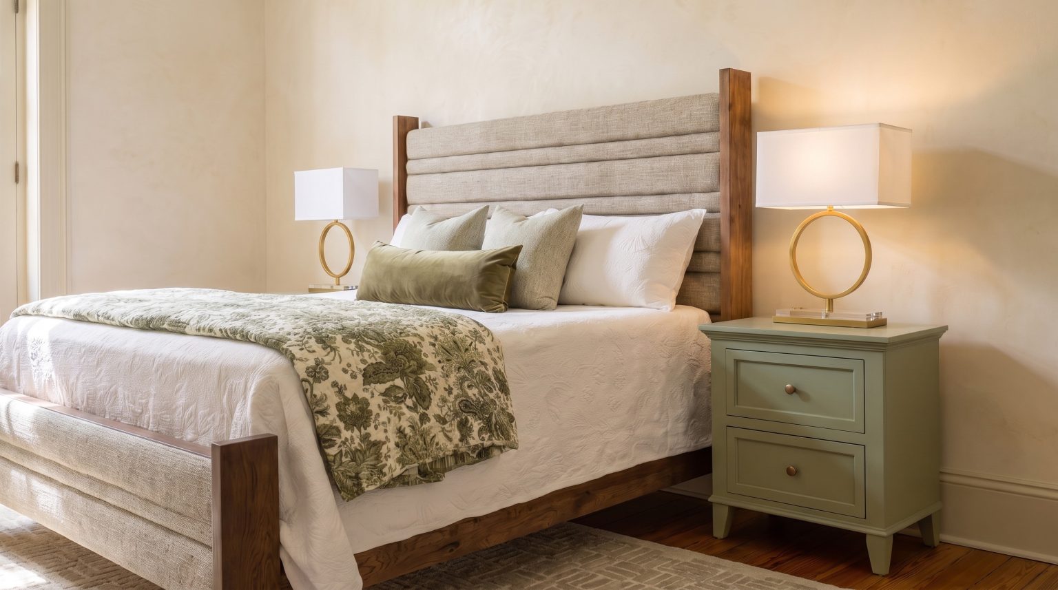 Headboard and sage nightstand: Oatmeal channels between walnut posts, beside the painted stand.