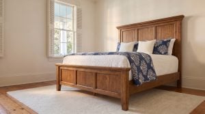 The paneled footboard: Three recessed panels to match the headboard.
