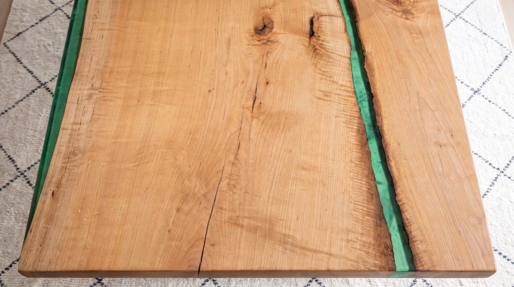 The emerald river: Narrow green resin between two curly maple edges.