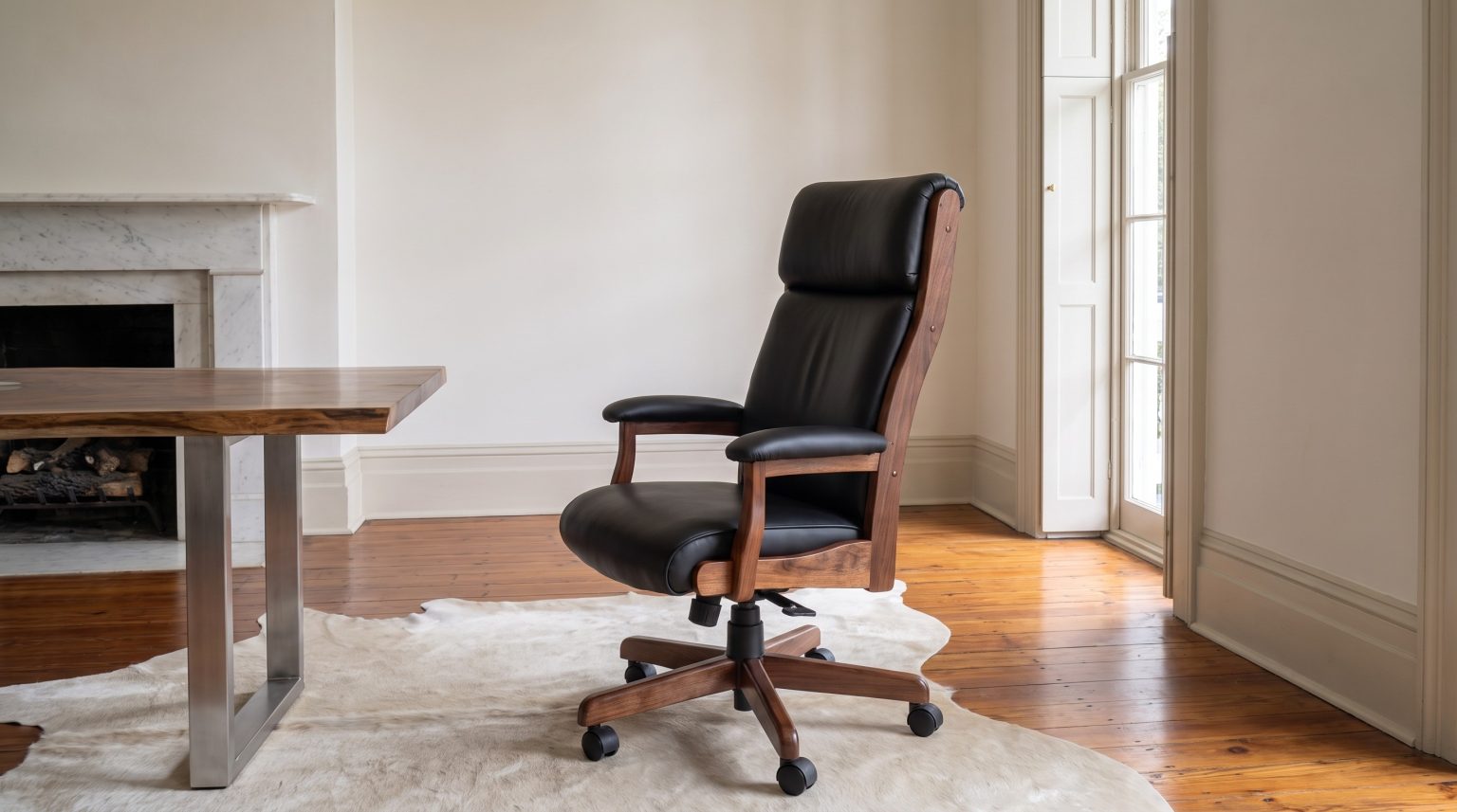 The leather chair: Black leather on a walnut frame with a wooden star base.