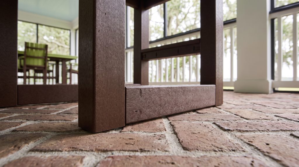 The sled runner: The front post meeting the floor runner on brick.