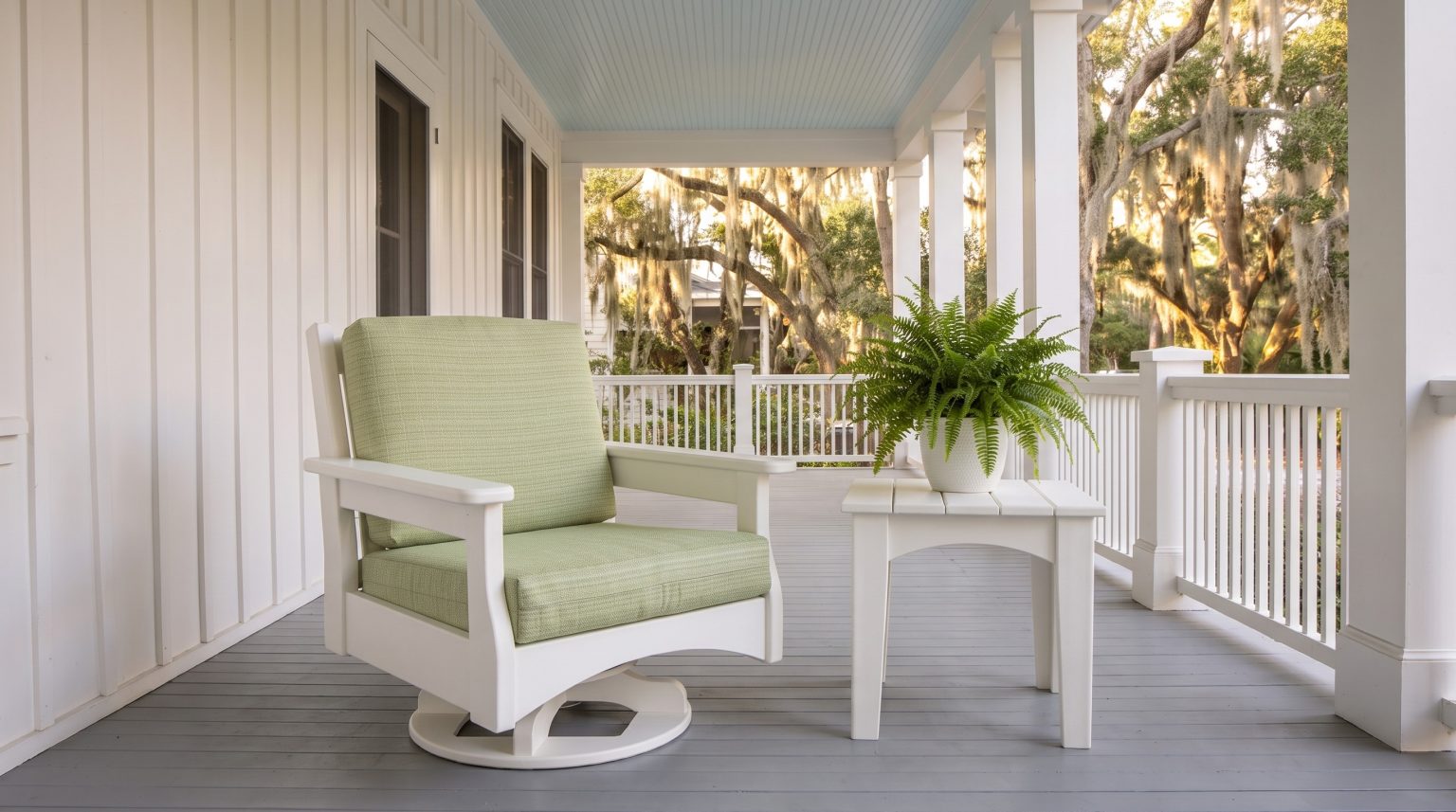 Chair and table: One swivel glider beside the square side table.