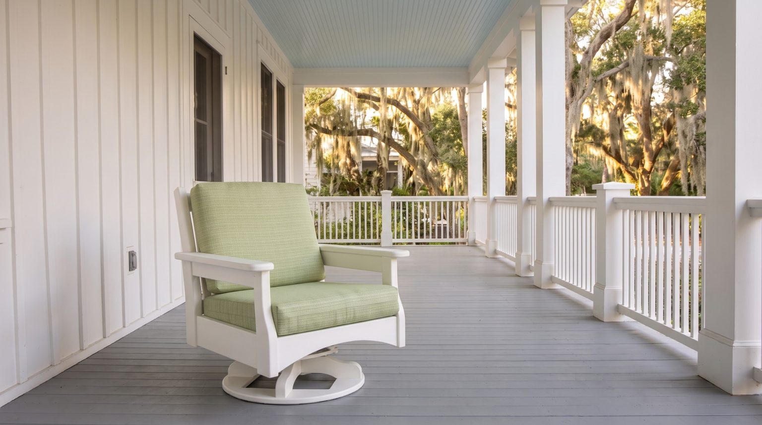 The swivel glider: A white frame on a round swivel glider base.