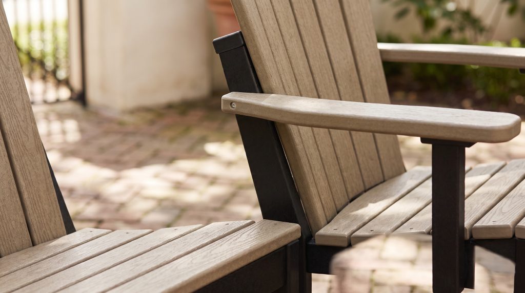 Tan on black: Tan back slats meeting the black chair frame.