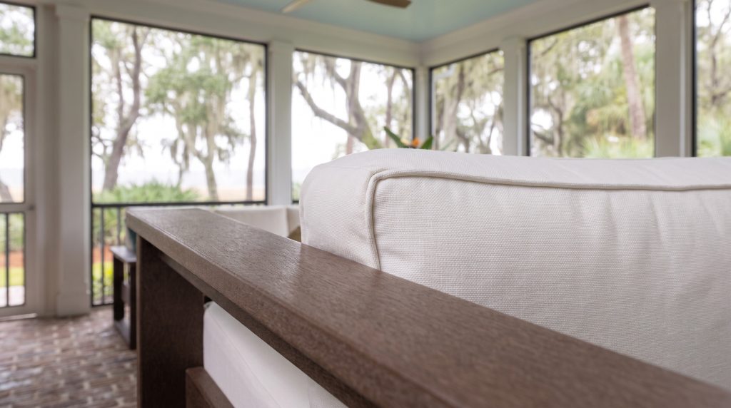 Arm and cushion: A flat brown arm cap against white canvas.