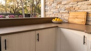 The cabinet run: White wood-grain doors with matte black pulls.