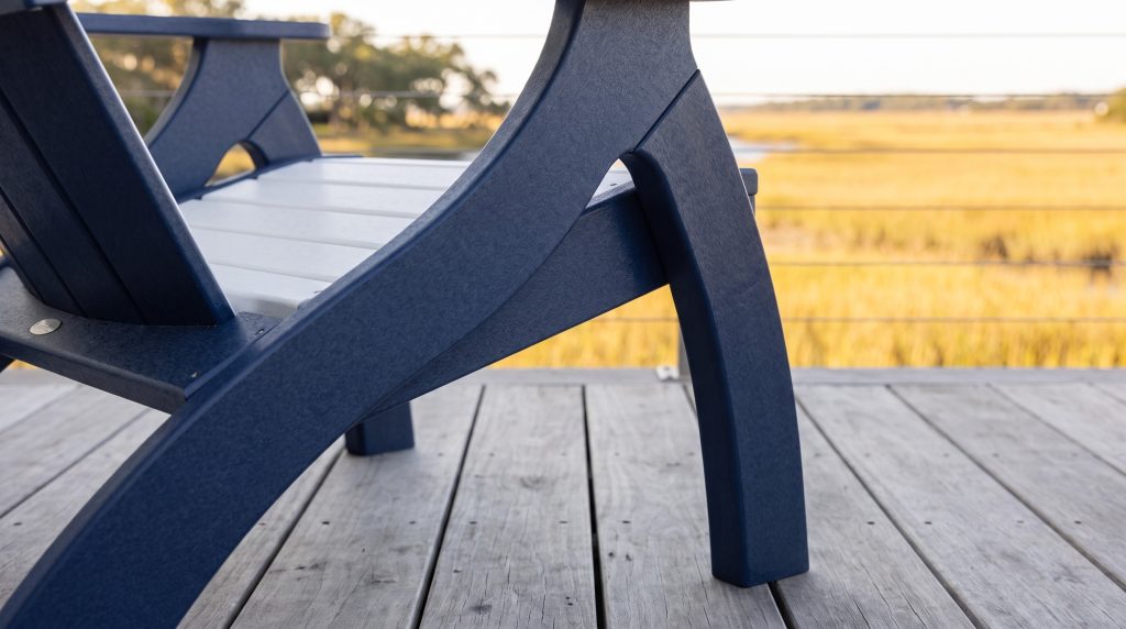 The navy leg: The curved navy leg meeting the white seat.