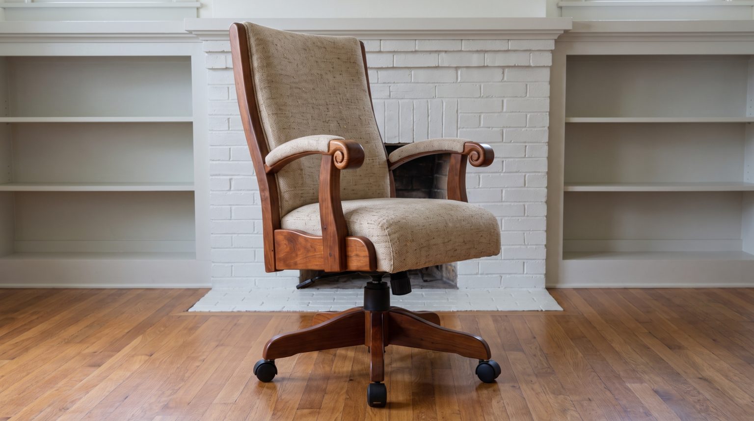 An office chair with curved wooden scroll arms and oatmeal tweed upholstery on a five-armed wooden base