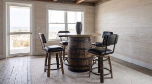 The pub table with two stools tucked in, the dunes beyond the window.
