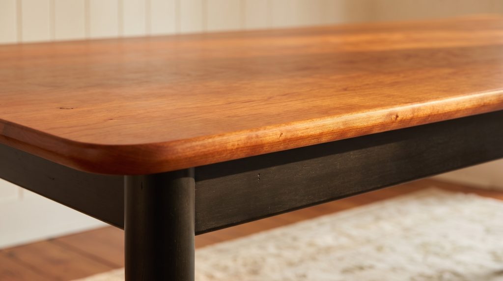 The rounded Tavern corner and eased edge over the flat black skirt.