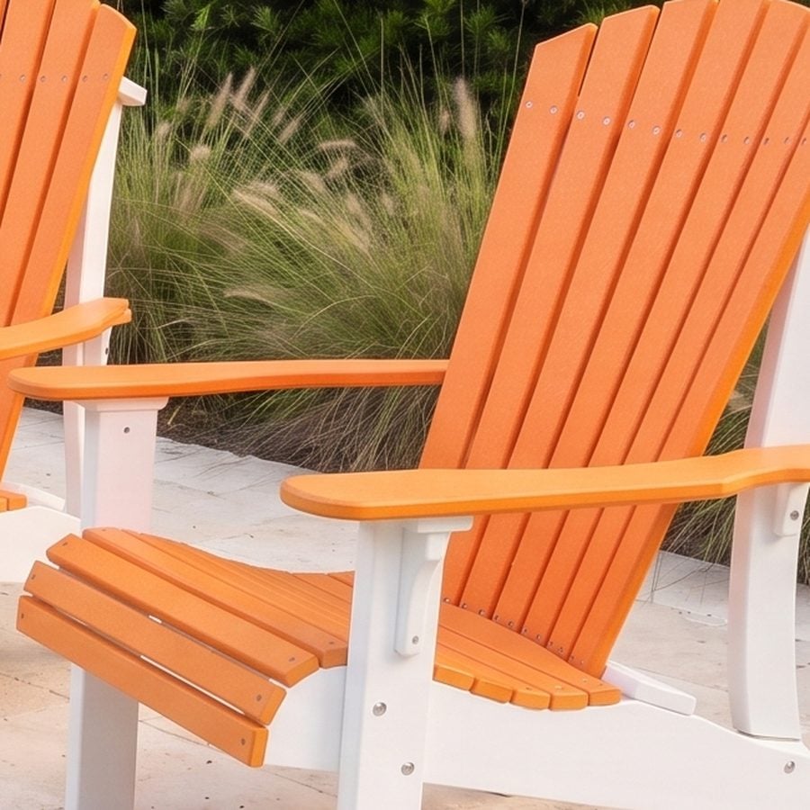 Close detail of the contoured fan back and wide arm on a poly Adirondack chair