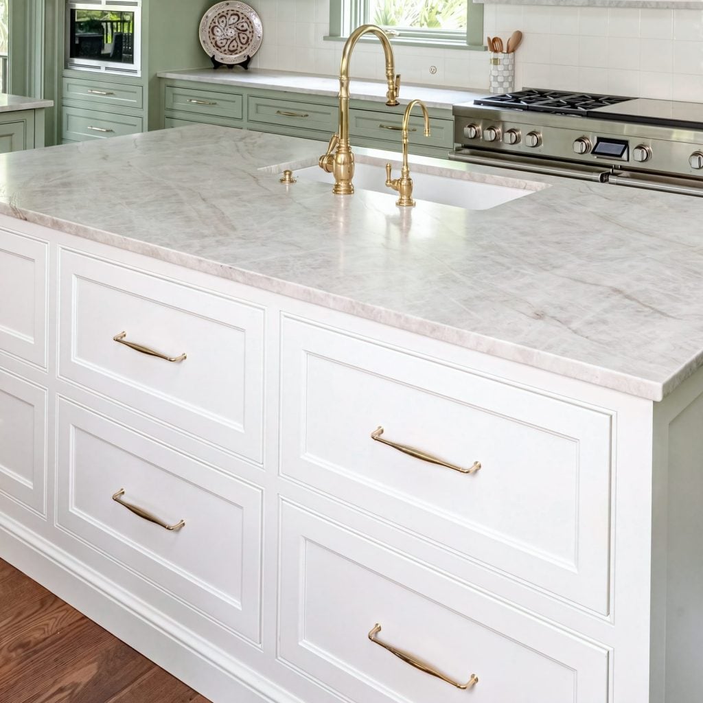 Inset and brass: Doors and drawers set flush in the face frame, with brass knobs and bar pulls.