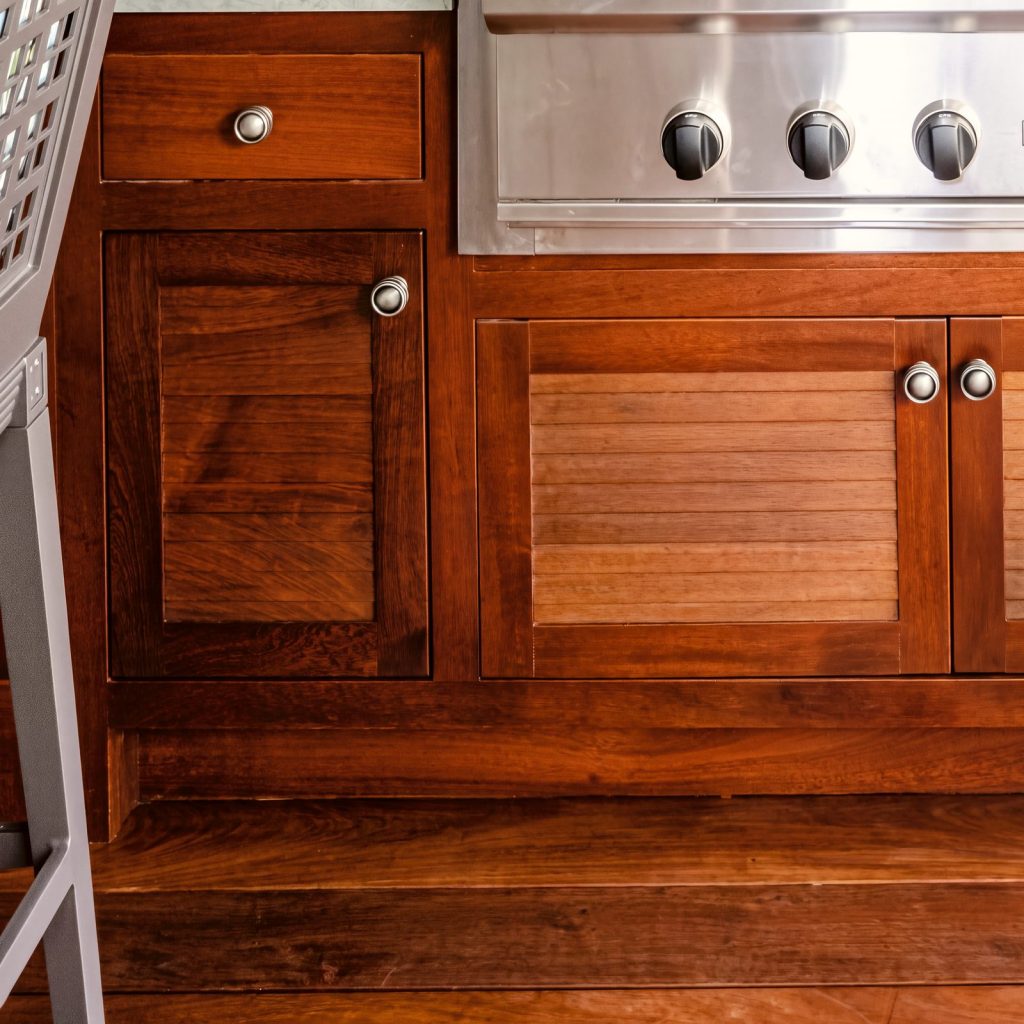 Mahogany louvers: Horizontal mahogany slats with round pewter knobs.