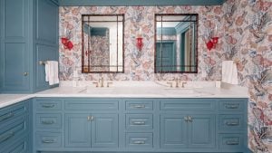 Double sinks: Two sinks with brass faucets over banks of inset drawers.
