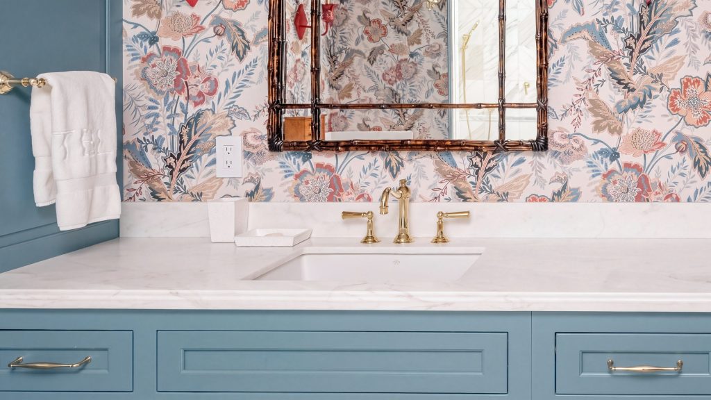 Marble and brass: Brass faucets on the marble top above inset drawers and doors.