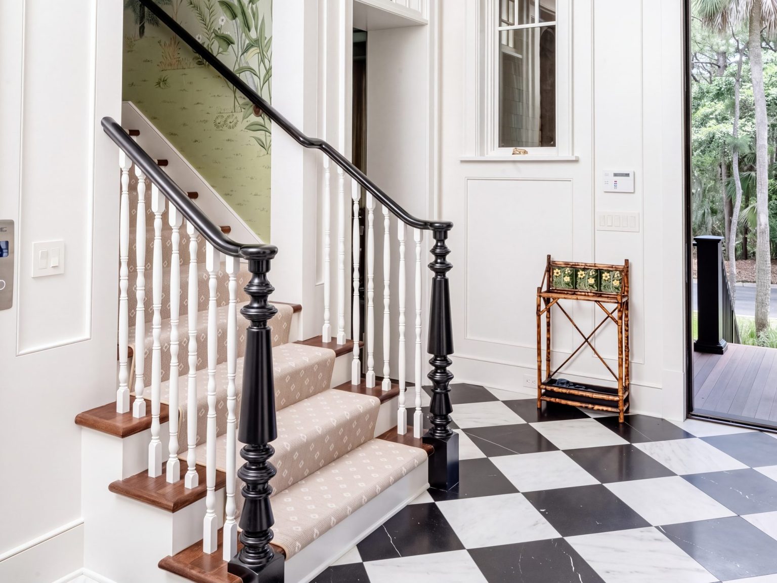 The stair: White balusters, black turned newels and a runner.