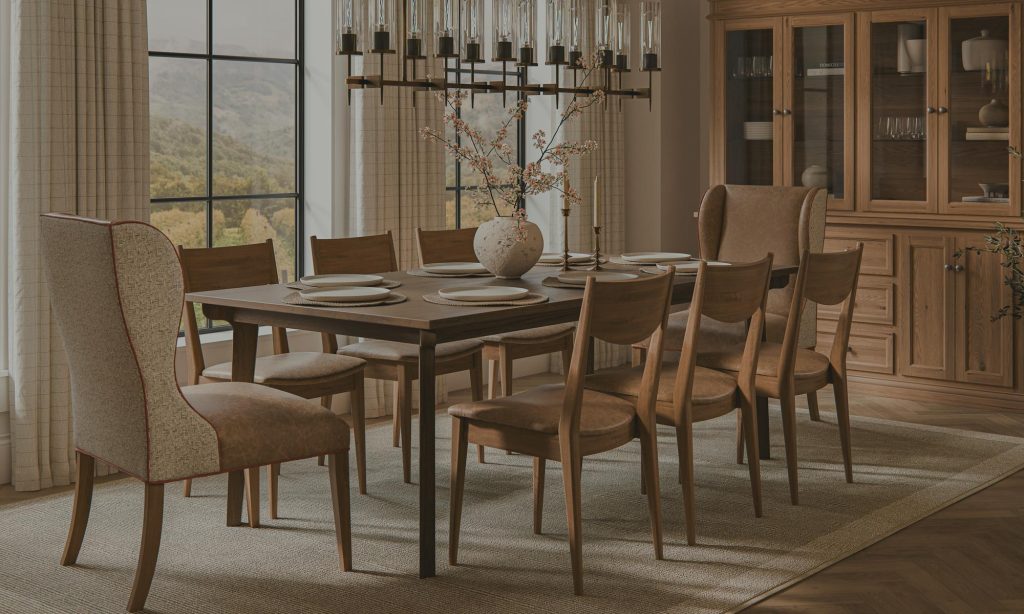 A solid hardwood dining table and chairs beneath a chandelier in a bright room