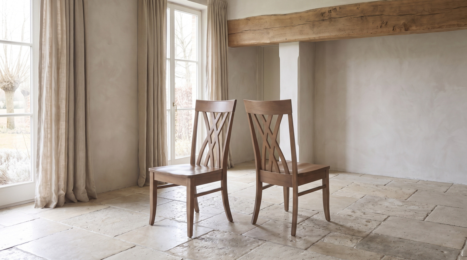 A pair of slat-back side chairs with crossed splats under a shaped crest rail