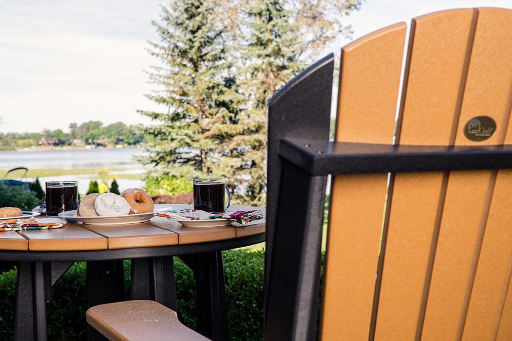 Amish-made poly outdoor dining furniture beside a lake