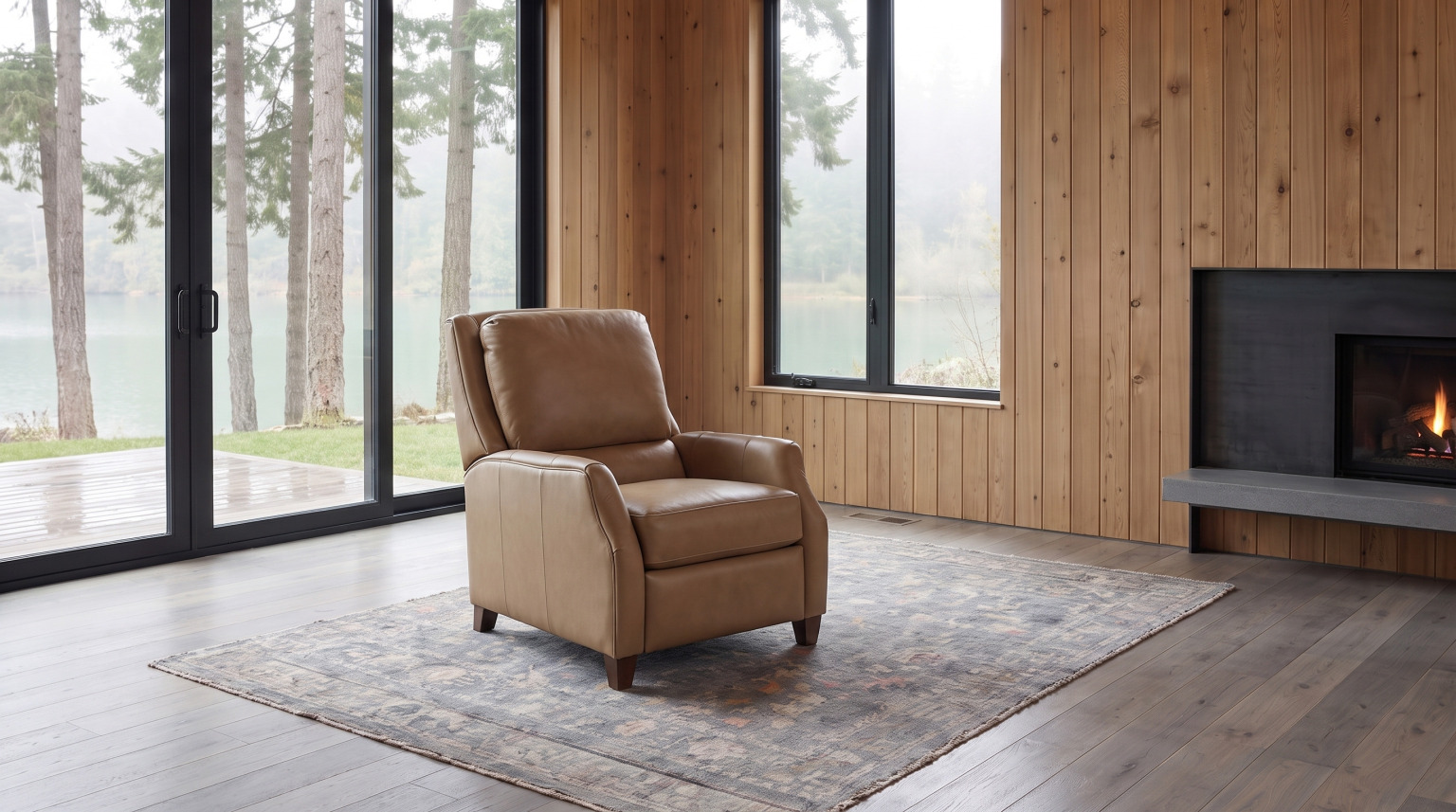 A caramel leather pressback reclining chair with a rolled arm on a faded wool rug